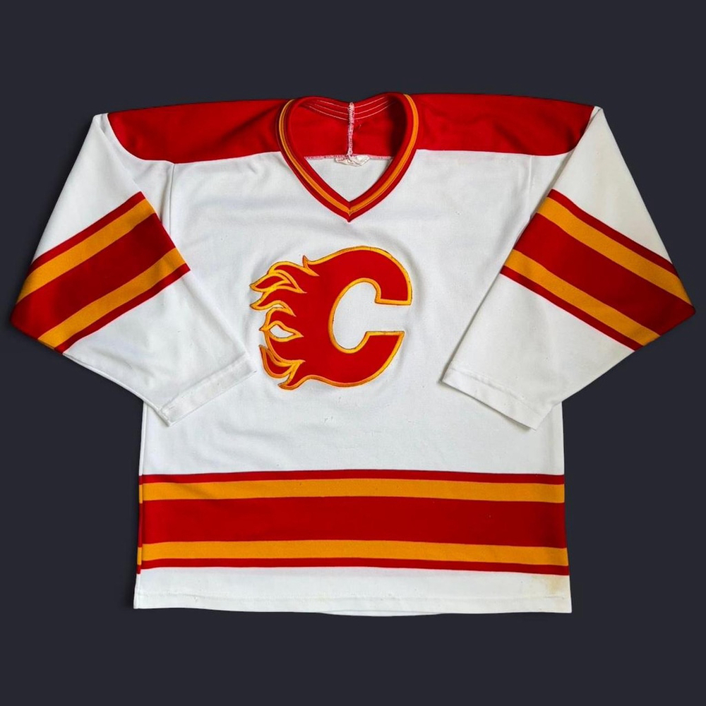 Vintage white, red, and gold Calgary Flames jersey